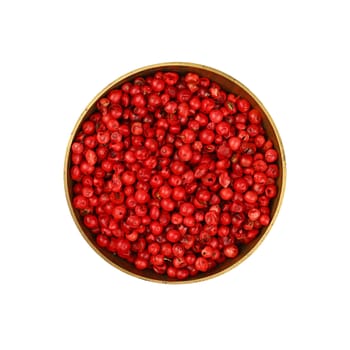 Close up one bronze metal bowl full of red pink pepper peppercorns isolated on white background, elevated top view, directly above