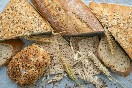 Assortment of baked goods on paper. Freshly of bakery products. View from above.