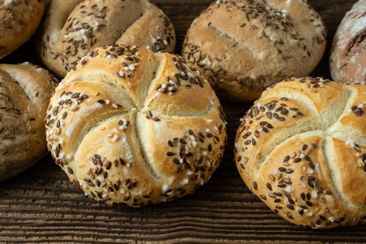 Different bread on a rustic wooden background. Bakery assortment of bread.