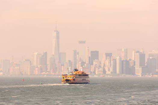 Staten Island Ferry and Lower Manhattan Skyline, New York City, USA.