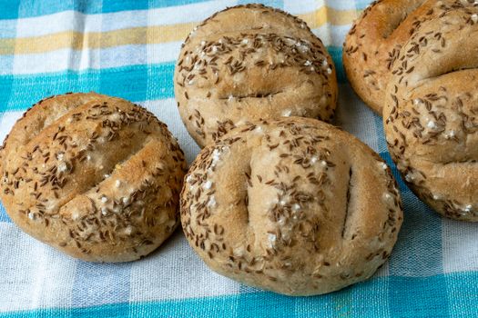 Bread rolls sprinkled with salt and caraway