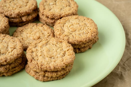 Tasty cookies biscuits. Stack of sugar cookies biscuits in green plate.