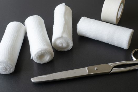 Medical bandages with scissors and sticking plaster. Medical equipment.