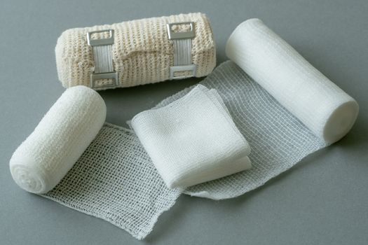 Medical bandages on gray background. Medical equipment.