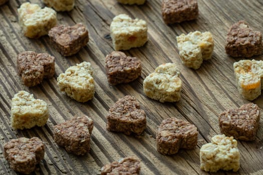 Cookies in heart shape on old wooden table