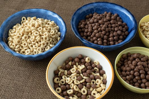 Set of various cereal bowl for breakfast. Corn rings with chocolate and cereal.