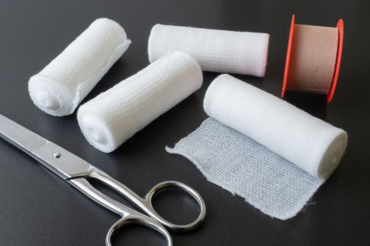 Medical bandages with scissors and sticking plaster. Medical equipment.