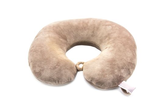 Brown neck pillows for travelling isolated on white background.