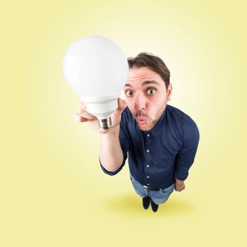  Funny young man with light bulb in his hand from above