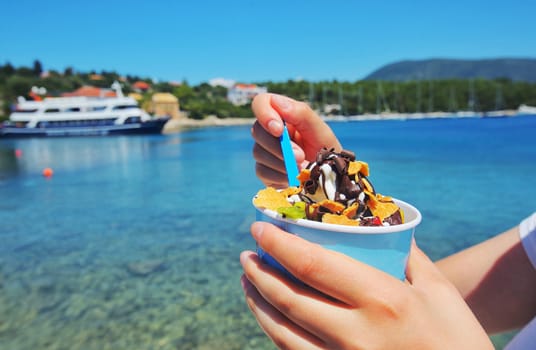 Girl eating ice cream in Greece