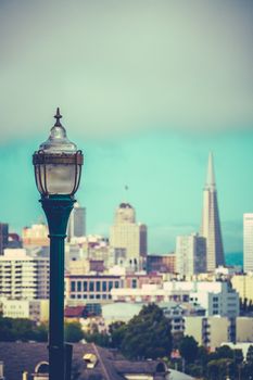 Retro Style Photo Of The San Francisco Skyline With Vintage Lamp In Foreground And Copy Space