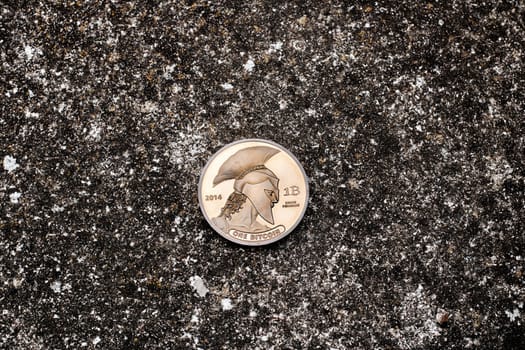 Digital currency physical bitcoin coin on the dark background.