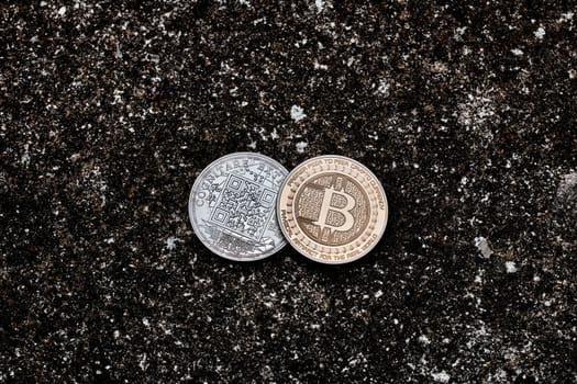 Digital currency physical bitcoin coin on the dark background.