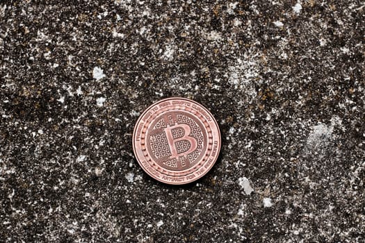 Digital currency physical bitcoin coin on the dark background.