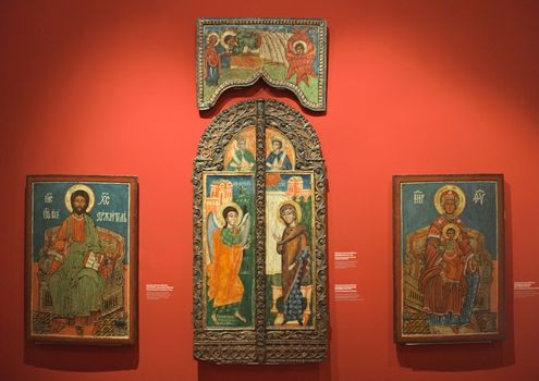 NOVI SAD, SERBIA - April 13th: Wooden Christian icons on red wall in museum