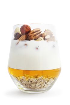 Breakfast smoothie ingredients in glass, cooking making concept, isolated on white background. Milkshake. Protein diet. Healthy food concept. Drink, oat flakes, milk, yoghurt, honey, nuts