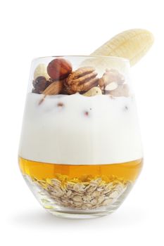 Breakfast smoothie ingredients in glass, cooking making concept, isolated on white background. Milkshake. Protein diet. Healthy food concept. Drink, oat flakes, milk, yoghurt, honey, nuts, banana