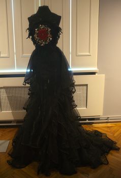 Elegant vintage woman black dress in museum