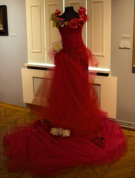 Elegant vintage woman red dress in museum