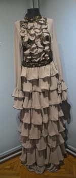 Elegant vintage woman gray dress in museum