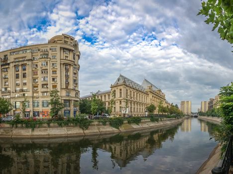 BUCHAREST, ROMANIA - 07.20.2018. Dambovita river in Bucharest in a cloudy summer day