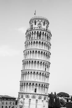 Leaning Tower of Pisa o Cathedral square in Pisa, Tuscany, Italy. Black and white image.