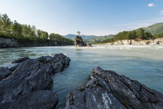 Fast mountain river Katun in Altay, Siberia, Russia. A popular tourist place called the Dragon's Teeth