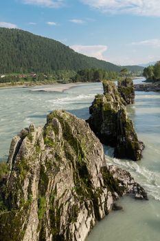 Fast mountain river Katun in Altay, Siberia, Russia. A popular tourist place called the Dragon's Teeth