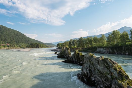 Fast mountain river Katun in Altay, Siberia, Russia. A popular tourist place called the Dragon's Teeth