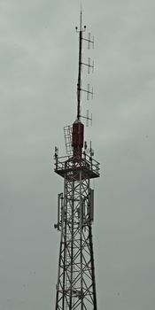 Upper part of steal radio tower with antennas