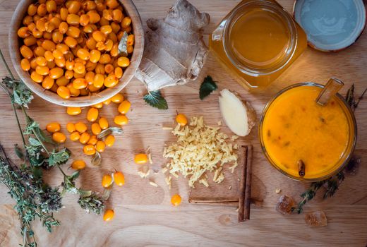 ingredients for cocktail recipe with seaberries and honey. View from above