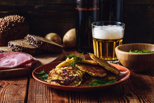 Potato Pancakes with Other Snacks and Glass of Beer