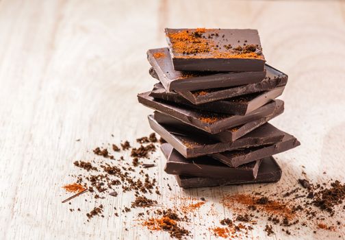 Stack of Chocolate Bar with Cayenne powder.