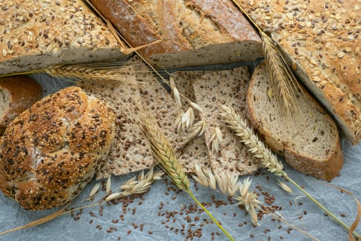 Assortment of baked goods on paper. Freshly of bakery products. View from above.