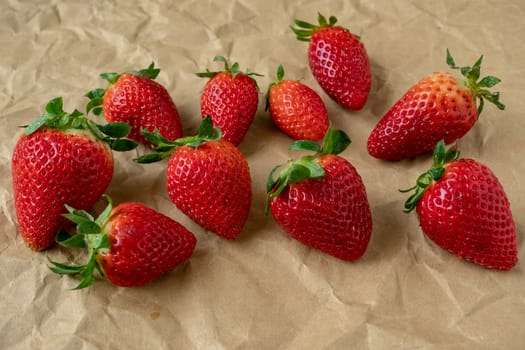 Fresh strawberries on the brown paper