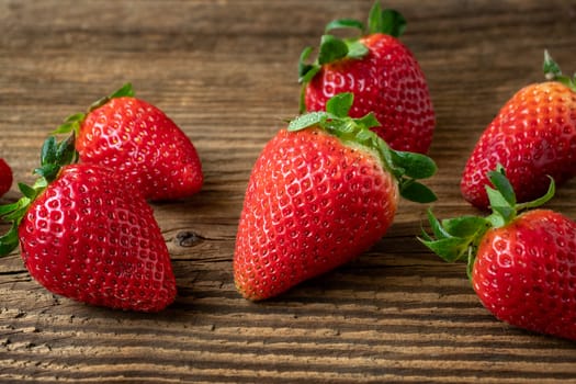 Ripe strawberries on a wooden table