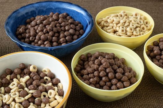 Set of various cereal bowl for breakfast. Corn rings with chocolate and cereal.