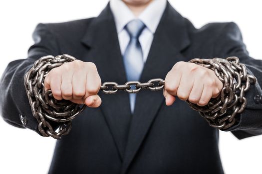 Business problems and failure at work concept - businessman struggles metal chain knot tied hands white isolated