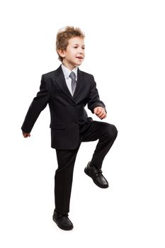Handsome smiling young businessman child boy walking for next achievement or promotion step white isolated