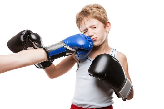 Martial art sport fail and lose concept - handsome boxer child boy in boxing gloves got punched