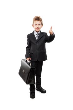 Handsome smiling young businessman child boy hand holding black leather briefcase gesturing thumb up success sign white isolated