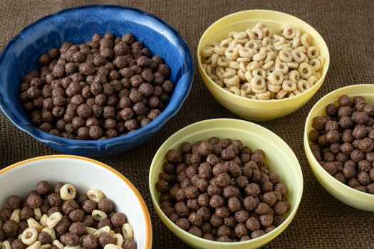 Set of various cereal bowl for breakfast. Corn rings with chocolate and cereal.