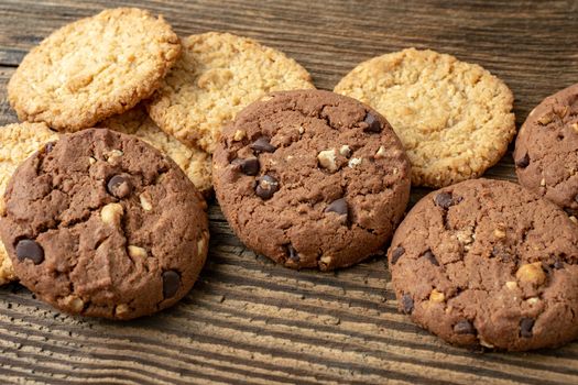 Various tasty cookies biscuits on wooden background