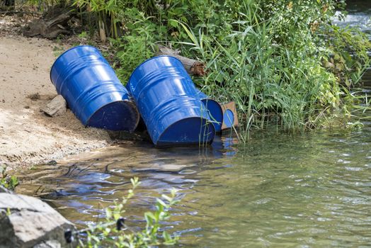 dumped blue oil drums cause pollution in the water, more and more the water is polluted by throwing away waste which therefore gets into the rivers
