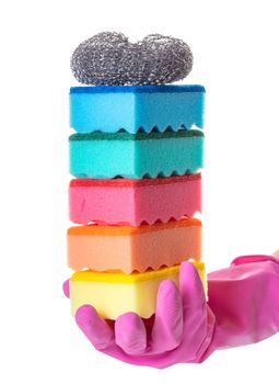 sponge for utensils in a female hand on white isolated background