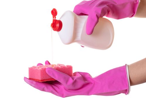 hands in gloves pour a detergent on a sponge for washing dishes