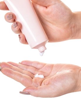 Female hands with a tube of cosmetic cream on white isolated background