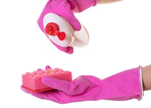 hands in gloves pour a detergent on a sponge for washing dishes