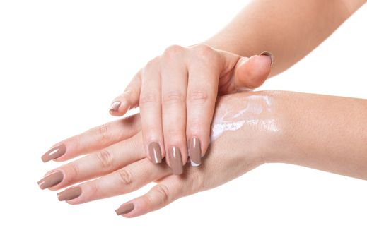 female hands in cosmetic cream on white isolated background