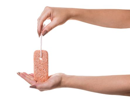 pumice stone in female hand on white isolated background